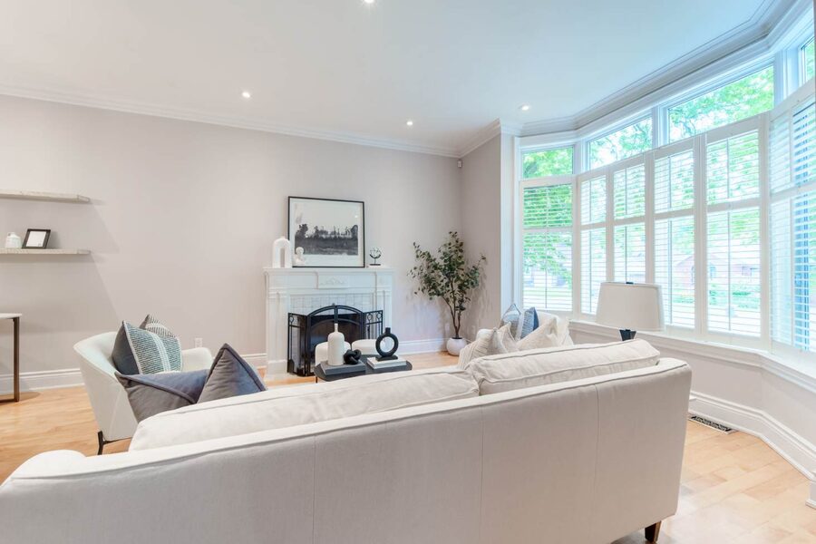 Staged living room with bay window at 24 Parkview Hill Crescent, East York
